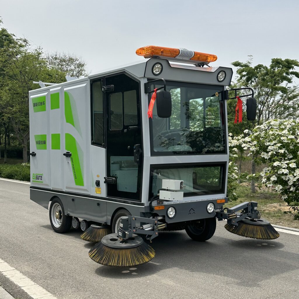 electric road cleaning vehicle brush system
